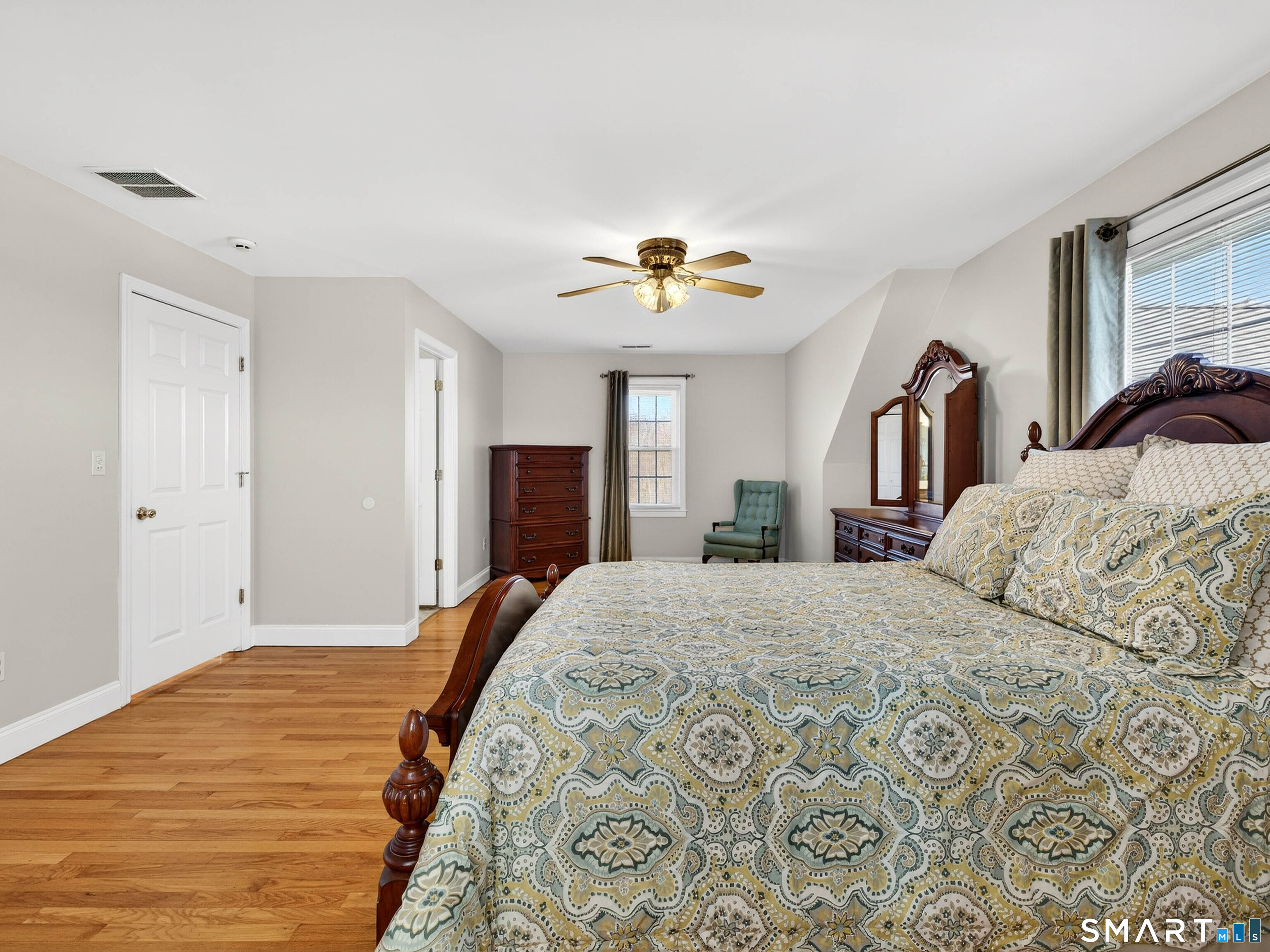 20 Colonial Heights Road East Haven, CT 06473 - Photo 22 of 39 a bedroom with a large bed and a chandelier