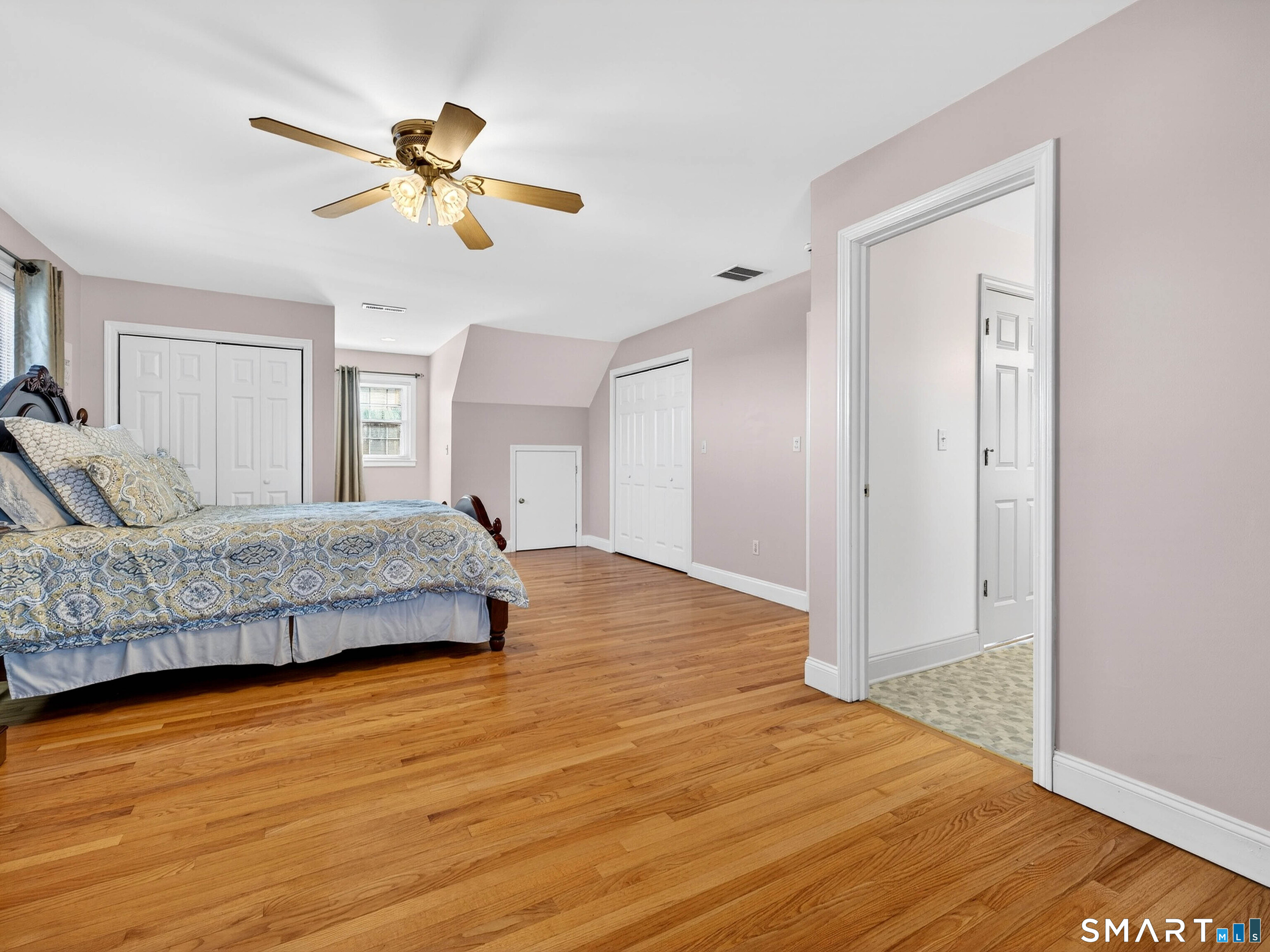 20 Colonial Heights Road East Haven, CT 06473 - Photo 23 of 39 a bedroom with a bed and wooden floor