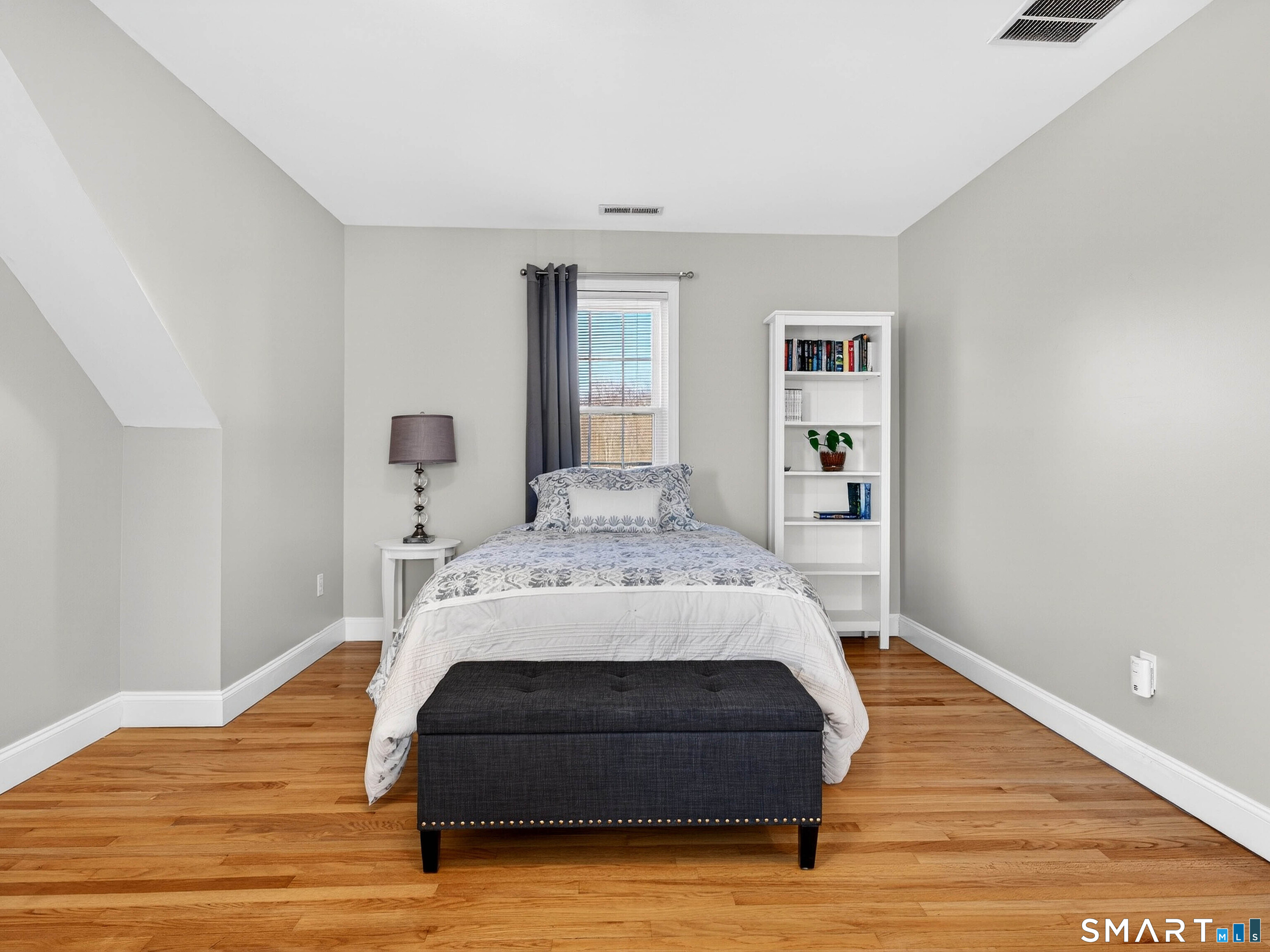 20 Colonial Heights Road East Haven, CT 06473 - Photo 24 of 39 a bedroom with a bed and wooden floor