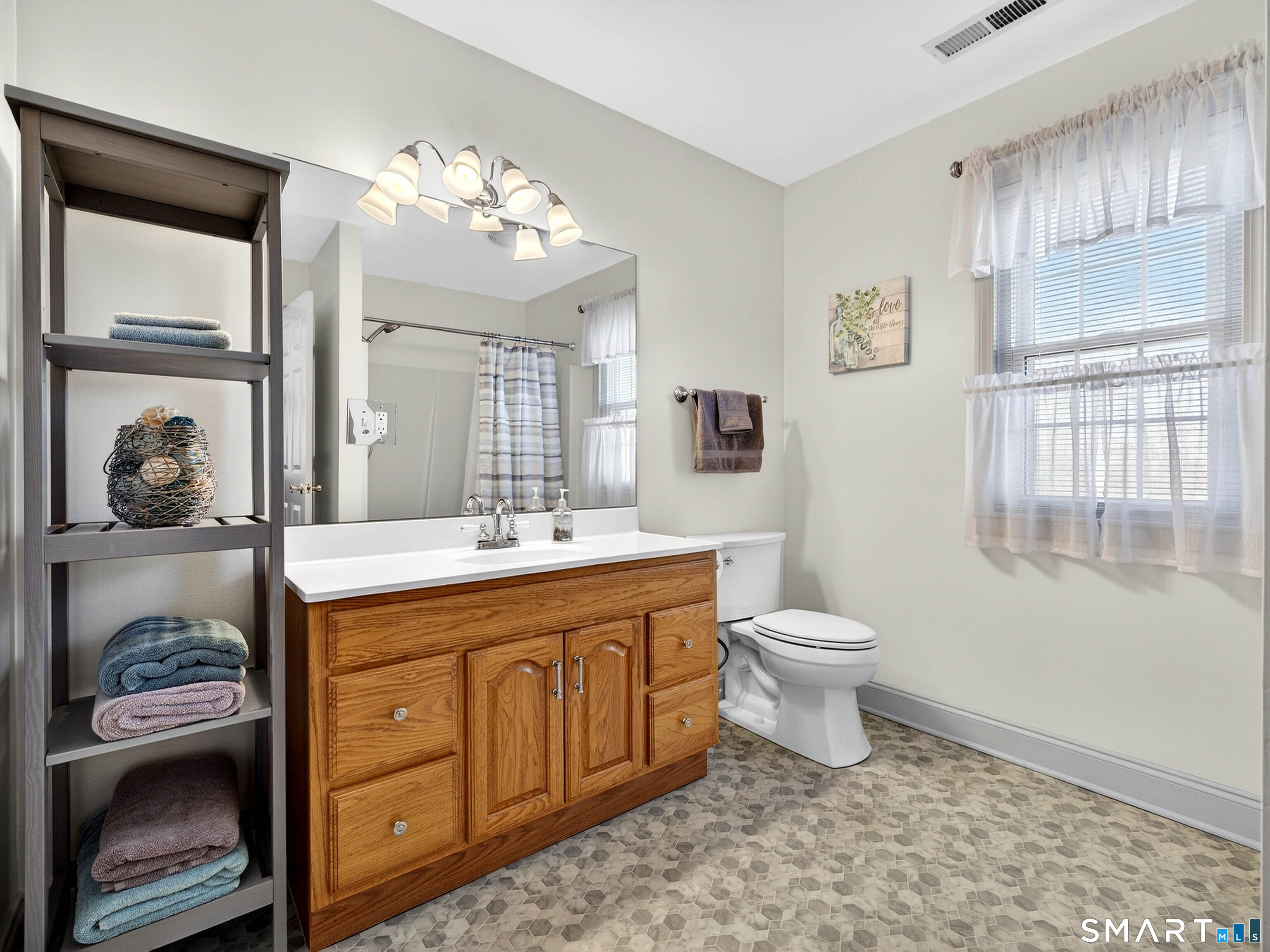 20 Colonial Heights Road East Haven, CT 06473 - Photo 26 of 39 a spacious bathroom with a granite countertop toilet a sink and a mirror