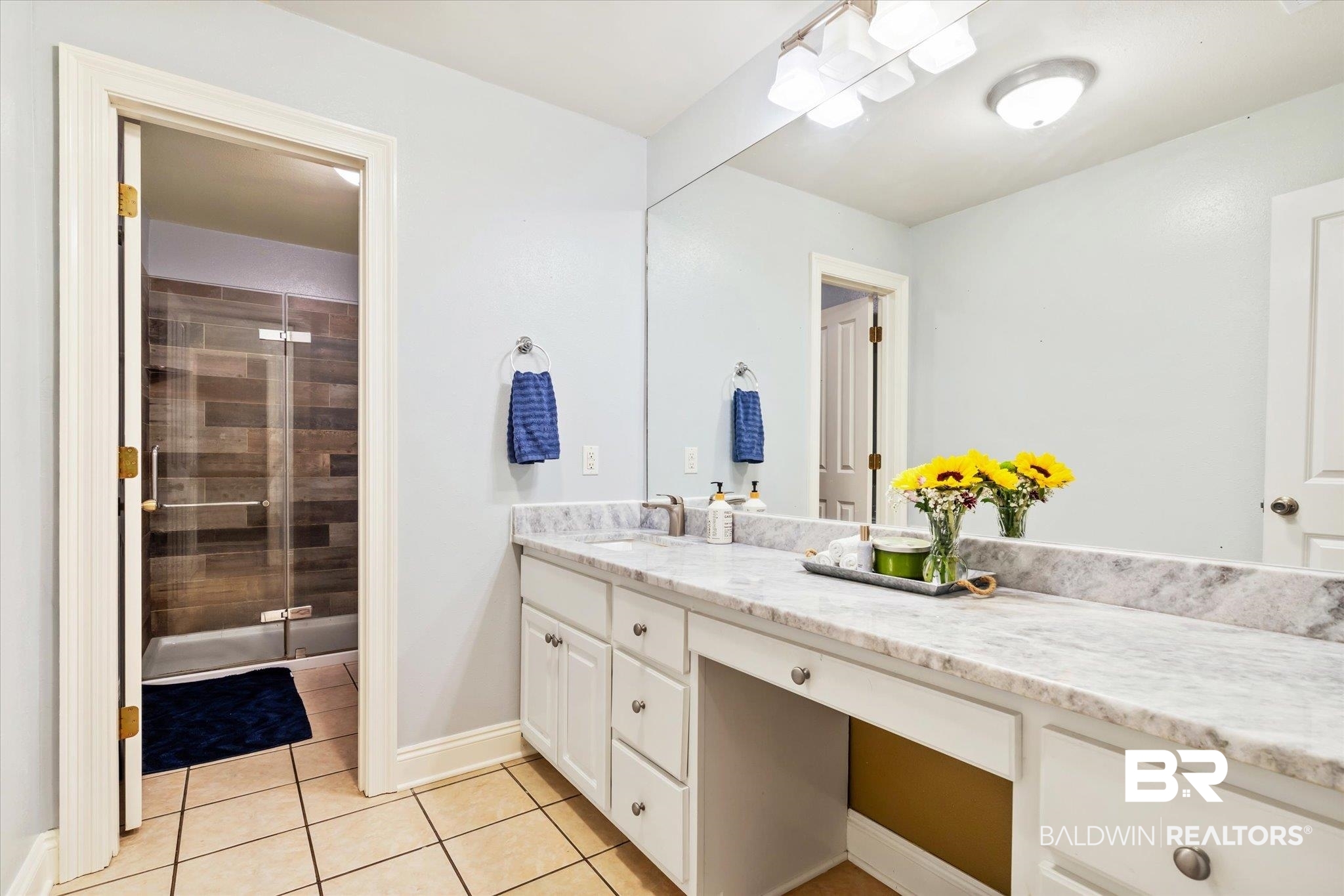 72 Limestone Drive Jackson, AL 36545 - Photo 25 of 38 Bathroom with tile patterned flooring, a shower with door, and vanity