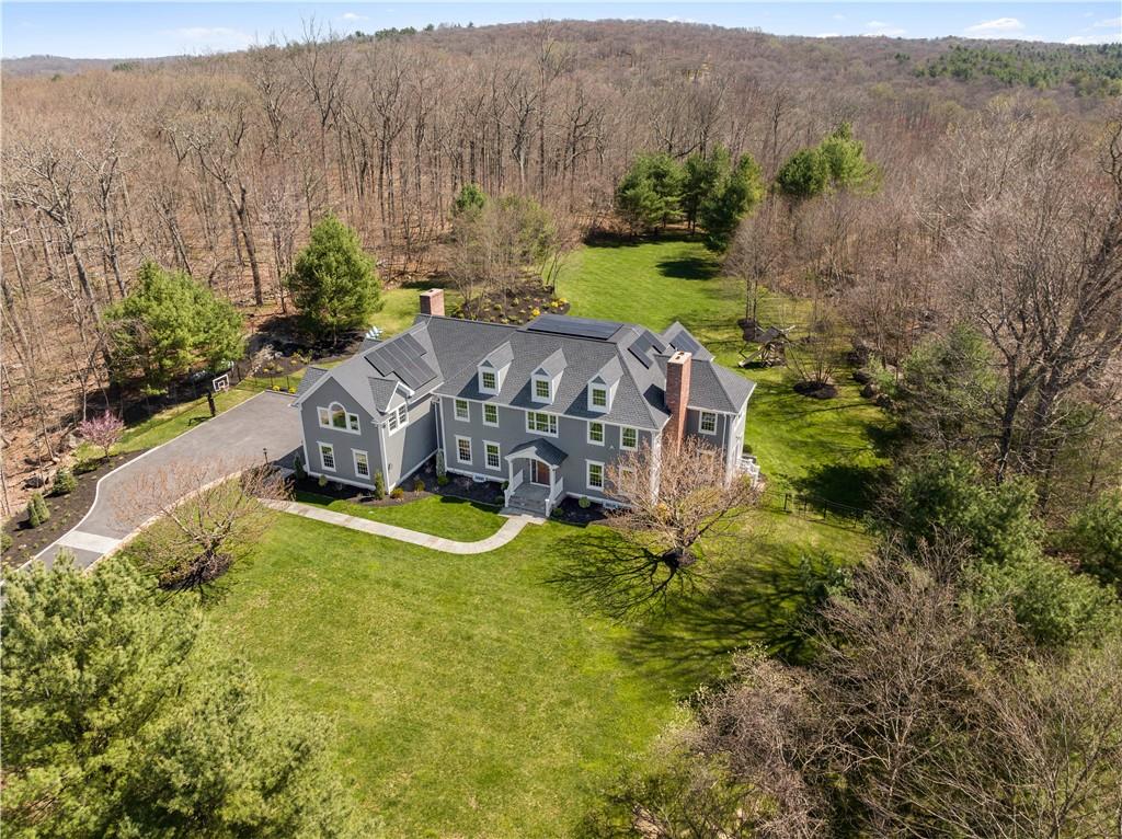 an aerial view of a house with a garden