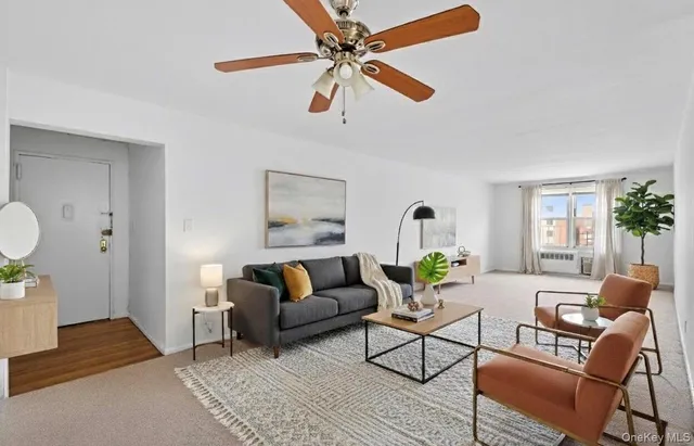 a living room with furniture and a rug