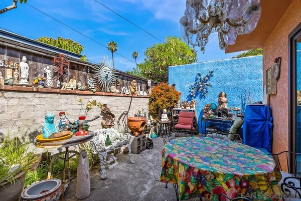 a outdoor dining area with lots of tables and chairs