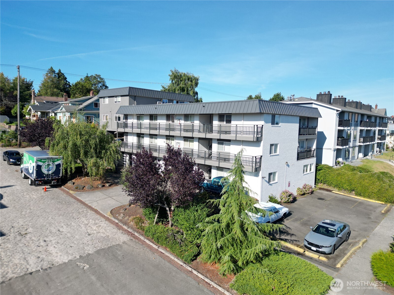 1002 North J Street Tacoma, WA 98403 - Photo 16 of 24 a view of building with an outdoor space and seating area