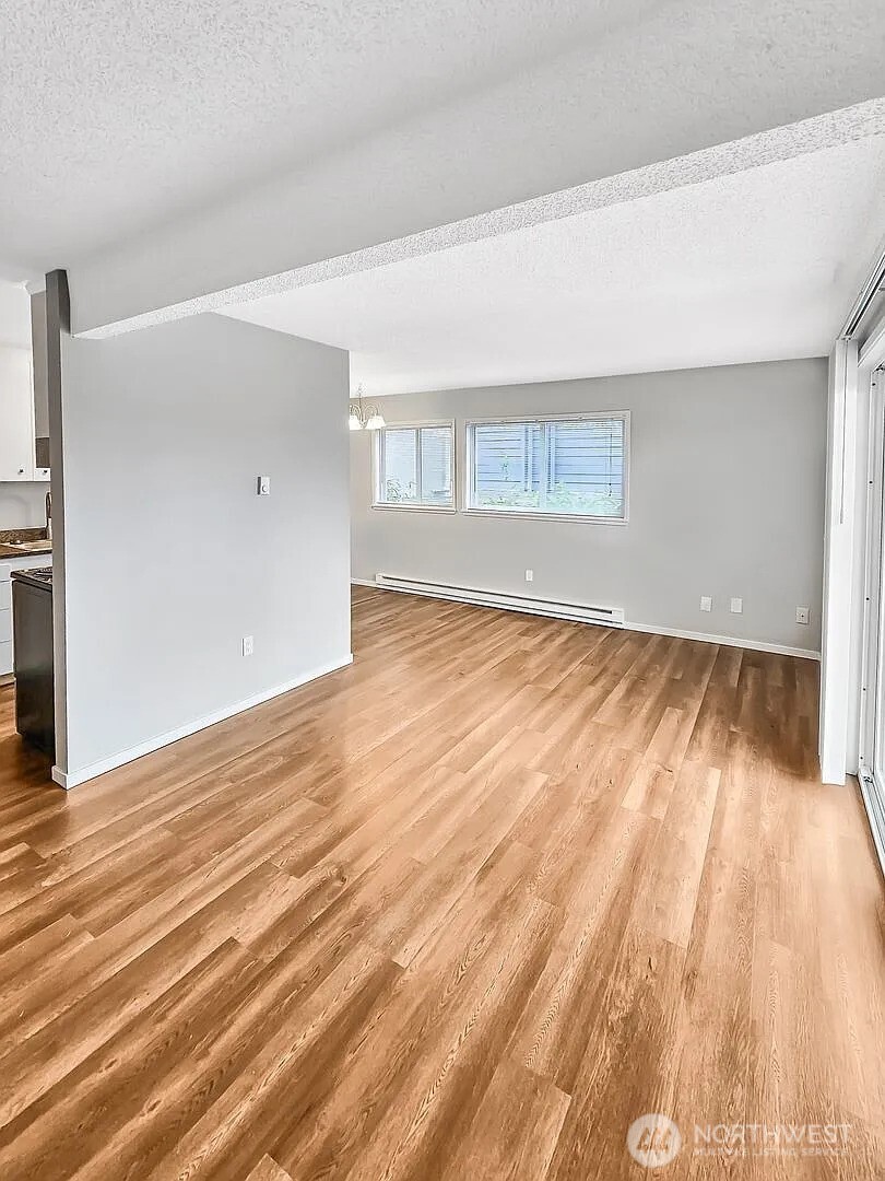 1002 North J Street Tacoma, WA 98403 - Photo 17 of 24 a view of an empty room with wooden floor