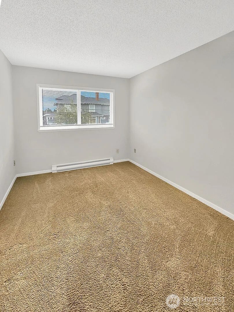 1002 North J Street Tacoma, WA 98403 - Photo 21 of 24 an empty room with a window