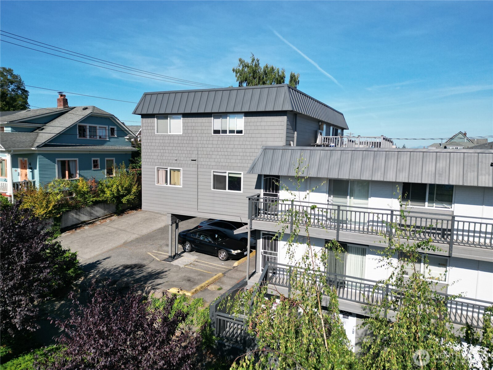 1002 North J Street Tacoma, WA 98403 - Photo 4 of 24 a front view of a house with a yard