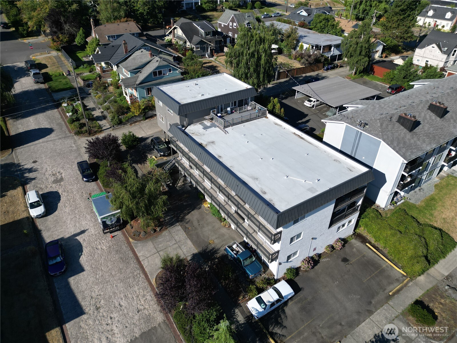1002 North J Street Tacoma, WA 98403 - Photo 10 of 24 an aerial view of a house with a swimming pool and outdoor seating
