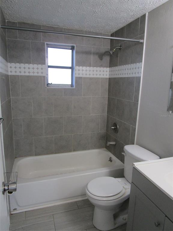 8947 Cairo Lane Port Richey, FL 34668 - Photo 6 of 17 a bathroom with a bathtub toilet and shower
