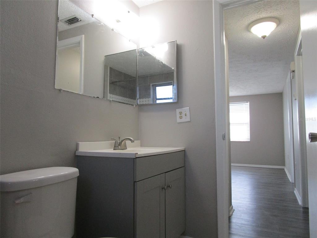 8947 Cairo Lane Port Richey, FL 34668 - Photo 8 of 17 a bathroom with a sink and a toilet