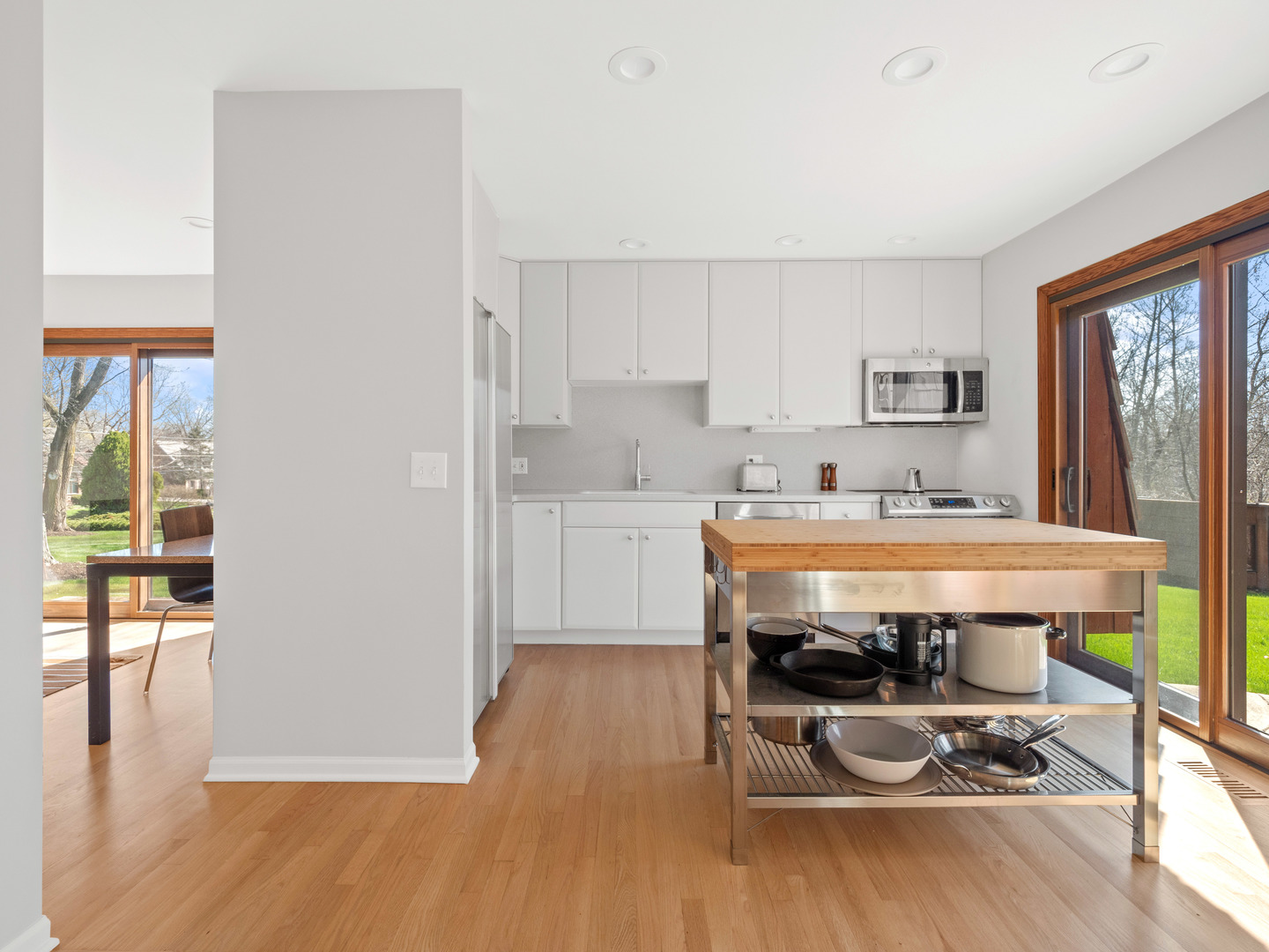 21W741 Bemis Road Glen Ellyn, IL 60137 - Photo 14 of 32 a room with stainless steel appliances wooden floors and kitchen view