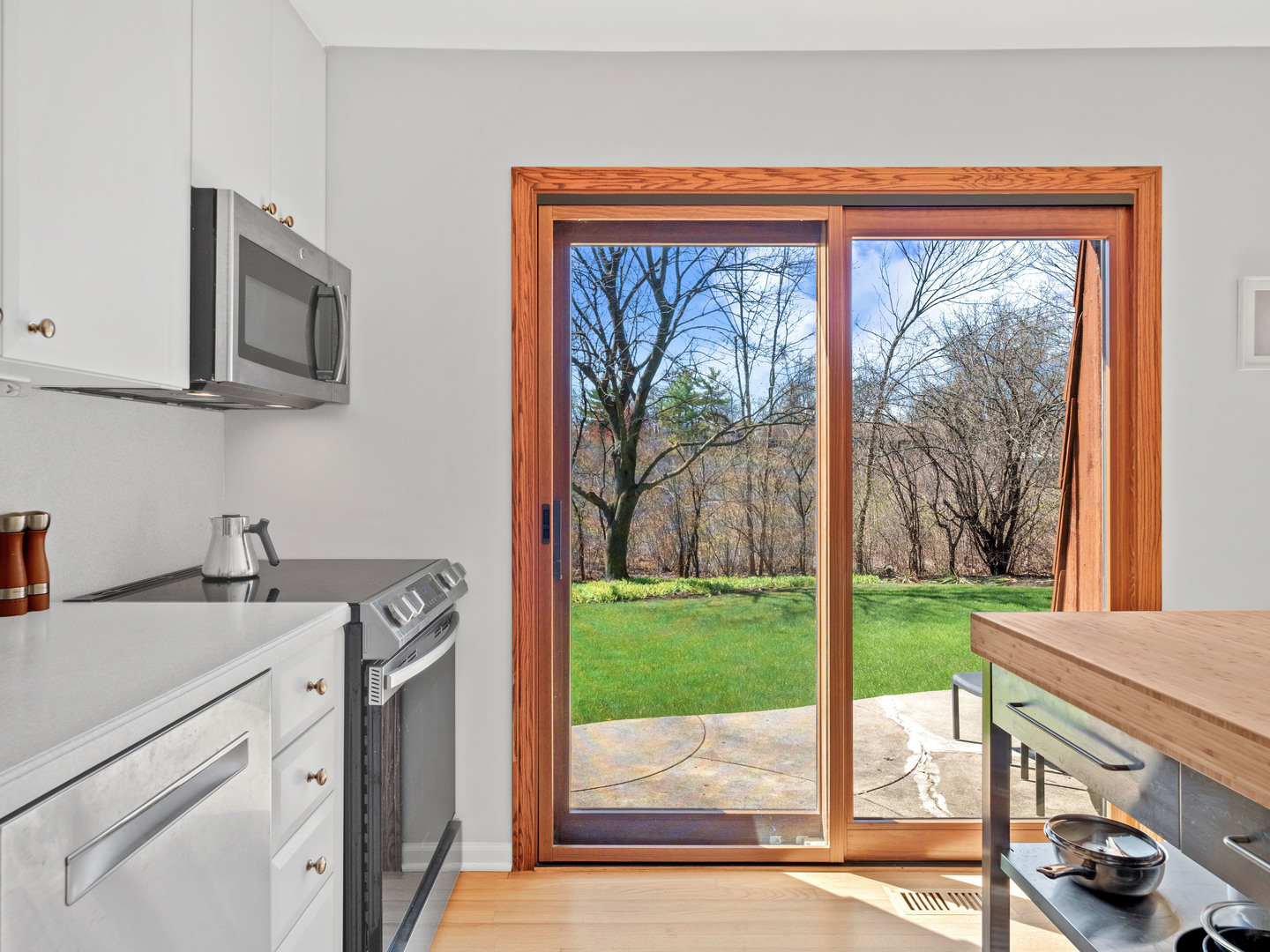 21W741 Bemis Road Glen Ellyn, IL 60137 - Photo 15 of 32 a kitchen with a sink and a view of living room