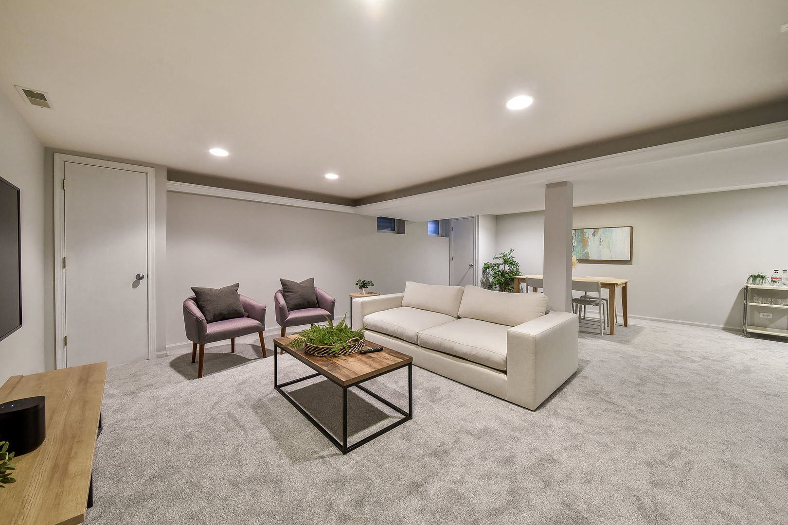 21W741 Bemis Road Glen Ellyn, IL 60137 - Photo 27 of 32 a living room with furniture and a flat screen tv