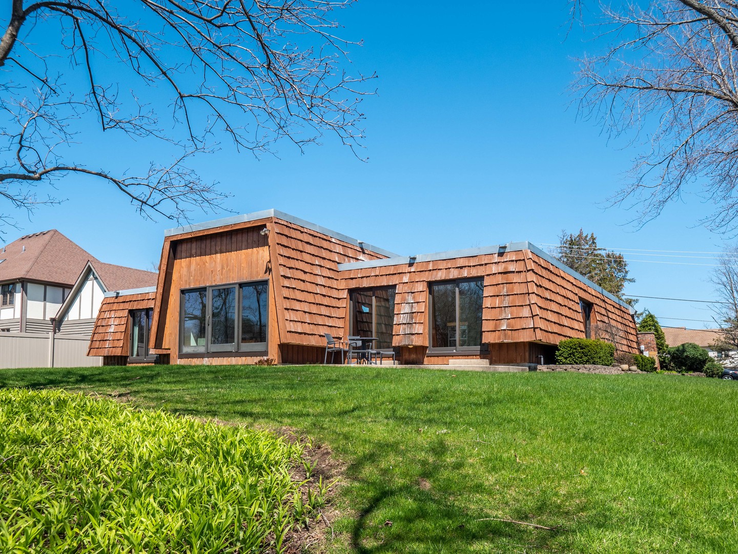 21W741 Bemis Road Glen Ellyn, IL 60137 - Photo 5 of 32 a backyard of a house with large trees and plants
