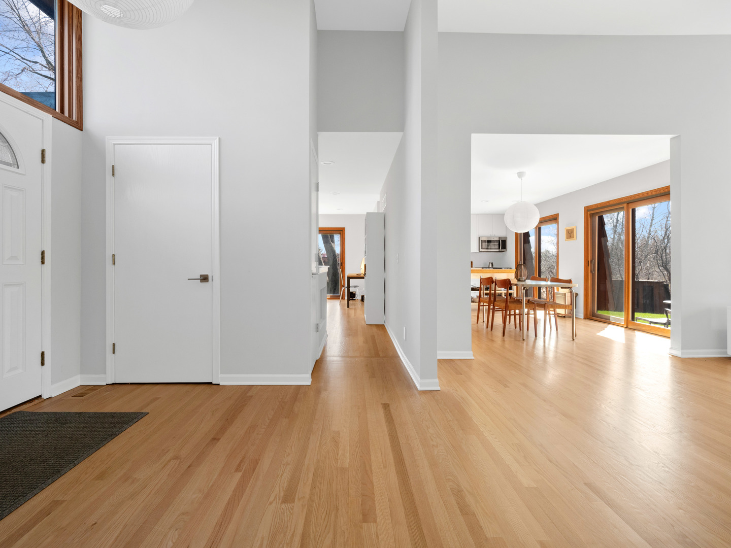 21W741 Bemis Road Glen Ellyn, IL 60137 - Photo 7 of 32 a view of a hallway view with wooden floor and a living room