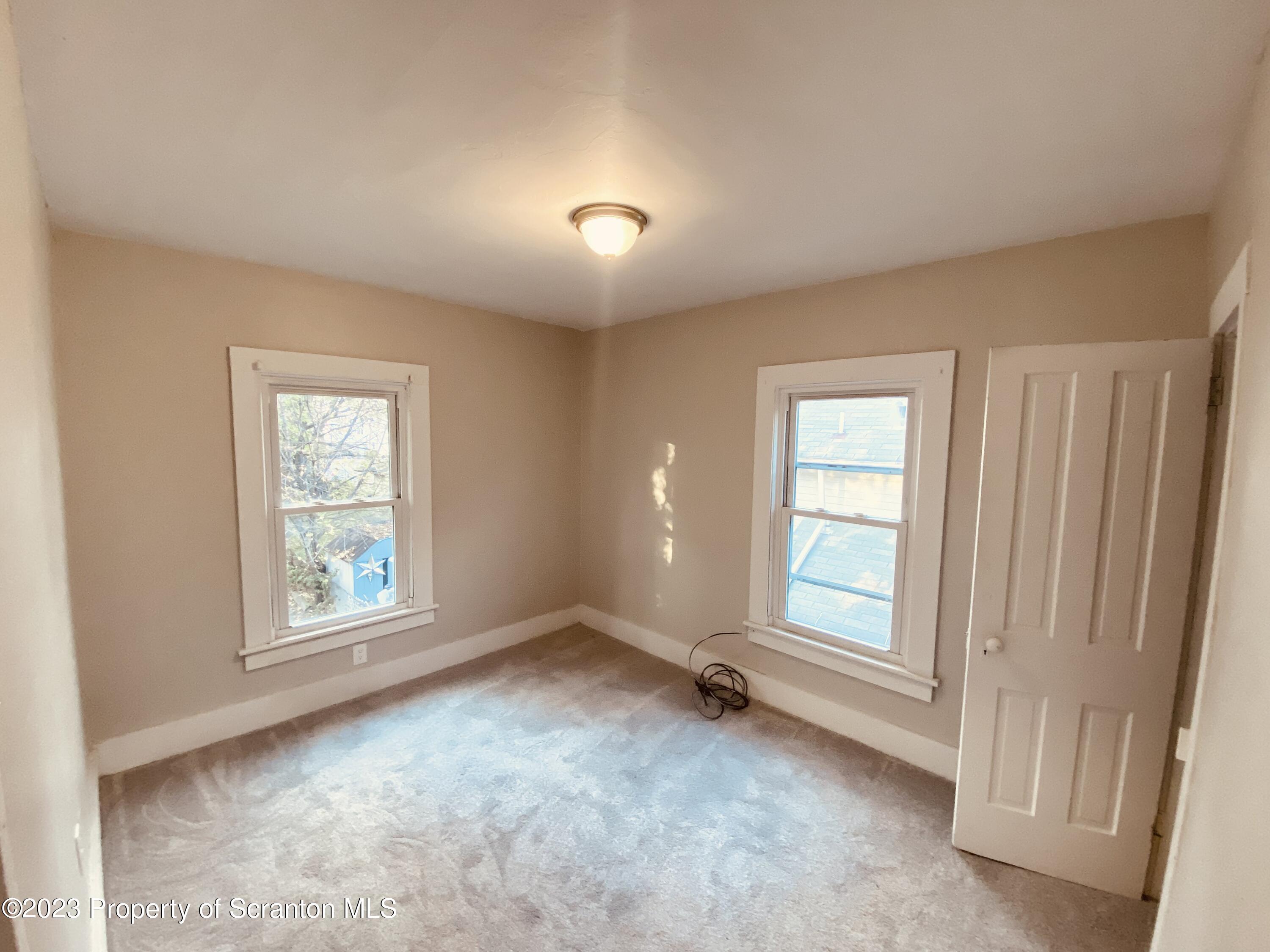 916 South 9th Avenue Scranton, PA 18504 - Photo 11 of 18 a view of an empty room with a window