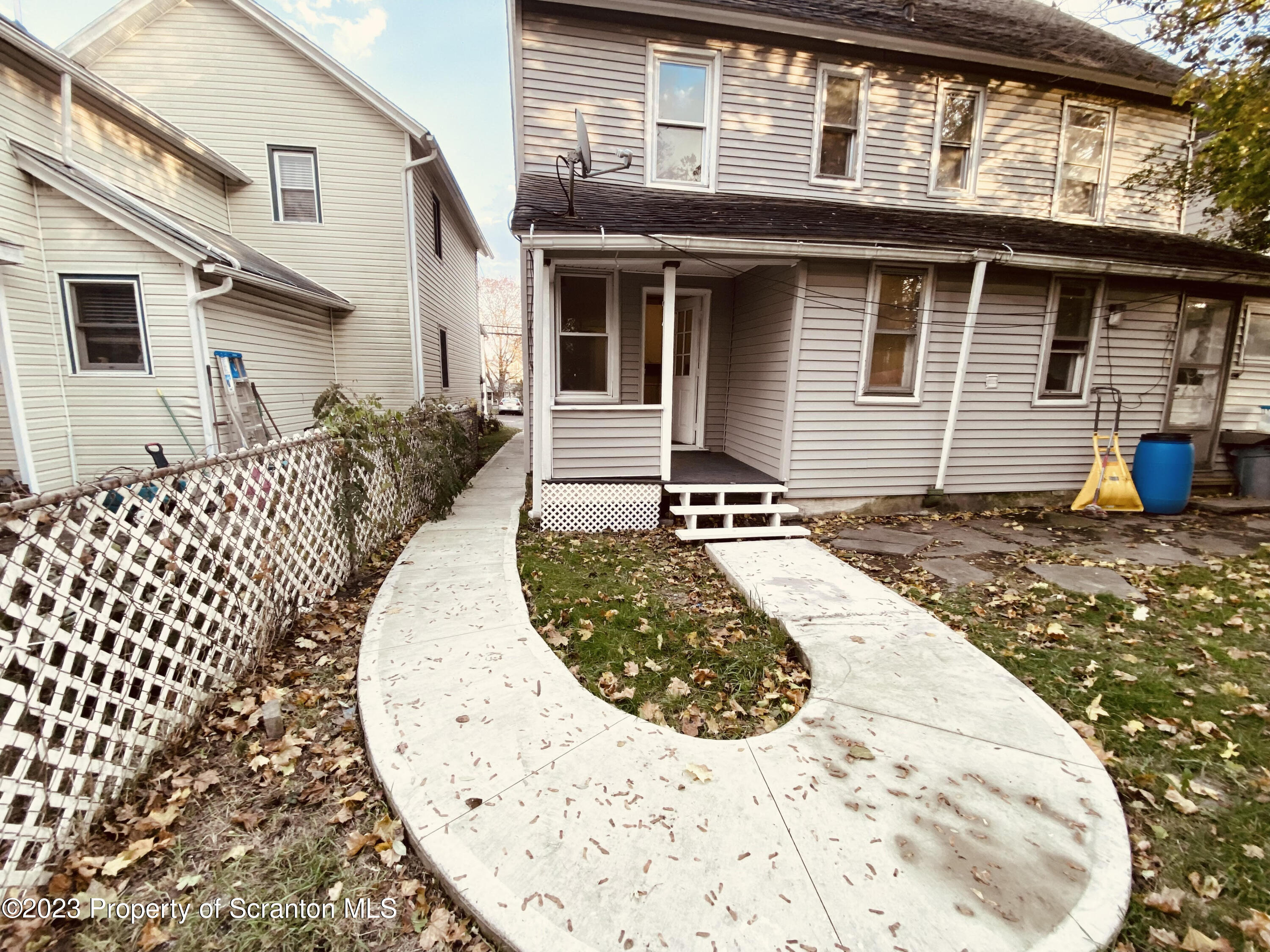 916 South 9th Avenue Scranton, PA 18504 - Photo 17 of 18 a view of a house with wooden fence
