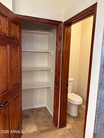 a bathroom with a granite countertop sink and shower
