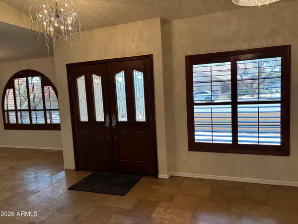 a view of entryway with a front door and wooden floor