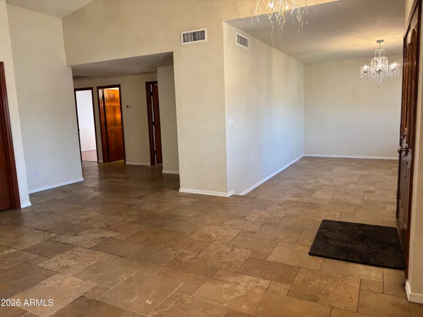 a view of a hallway with some doors
