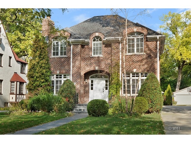 459 Sunset Road Winnetka, IL 60093 - Photo 1 of 16 a front view of a house with a yard