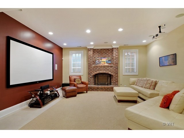 459 Sunset Road Winnetka, IL 60093 - Photo 11 of 16 a living room with furniture a projector and a flat screen tv
