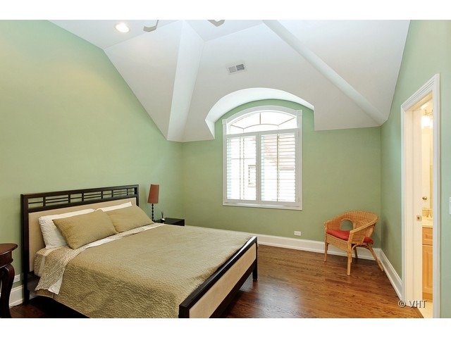 459 Sunset Road Winnetka, IL 60093 - Photo 14 of 16 a bedroom with a bed and window