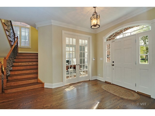 459 Sunset Road Winnetka, IL 60093 - Photo 2 of 16 a view of an entryway with wooden floor