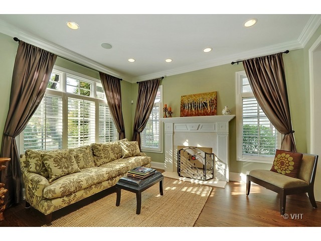 459 Sunset Road Winnetka, IL 60093 - Photo 3 of 16 a living room with furniture and a fireplace