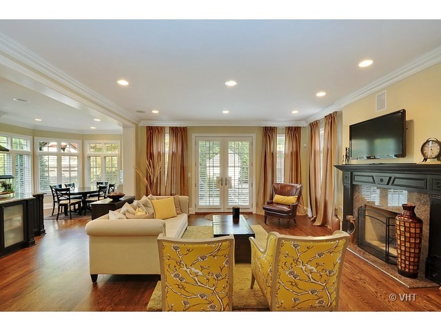 459 Sunset Road Winnetka, IL 60093 - Photo 7 of 16 a living room with fireplace furniture and a flat screen tv