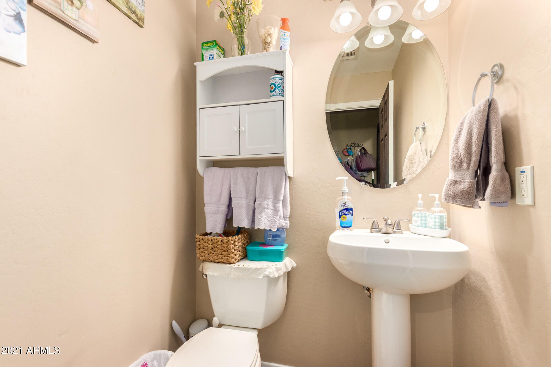 10225 West Camelback Road, Unit 8 Phoenix, AZ 85037 - Photo 13 of 30 a bathroom with a sink toilet and mirror