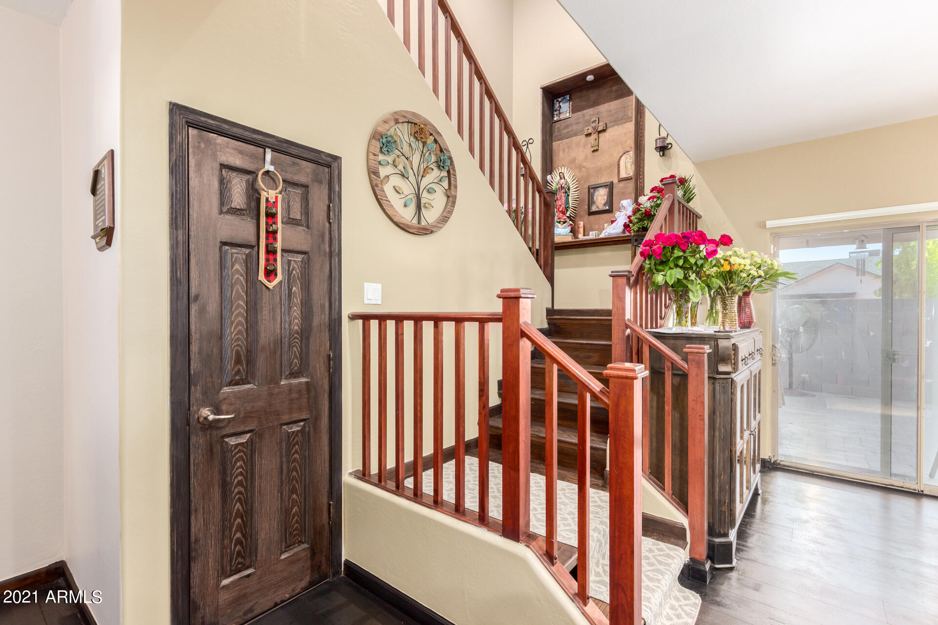 10225 West Camelback Road, Unit 8 Phoenix, AZ 85037 - Photo 15 of 30 a view of a hallway with paintings on the wall