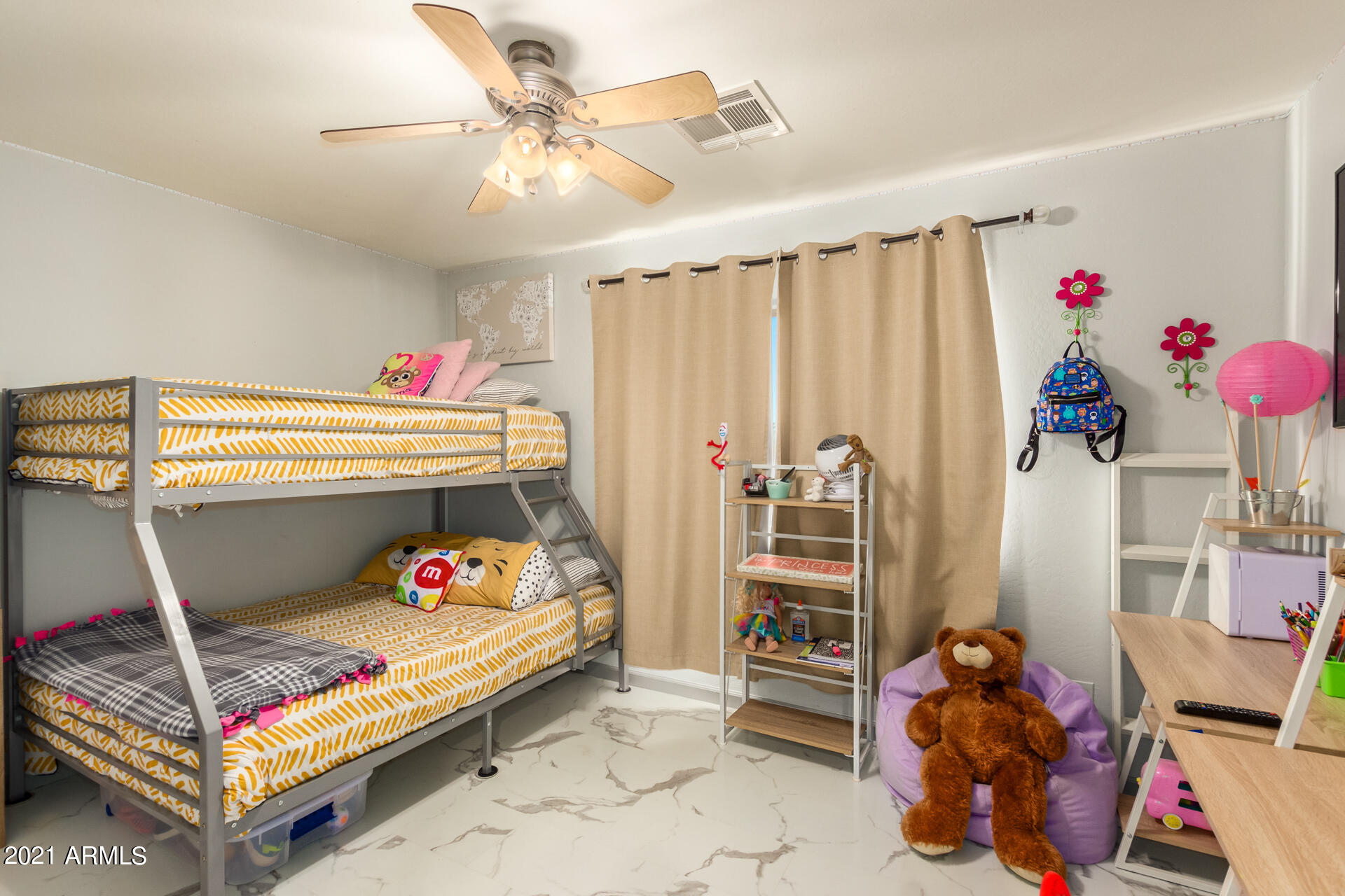 10225 West Camelback Road, Unit 8 Phoenix, AZ 85037 - Photo 18 of 30 a bedroom with a bed and a window