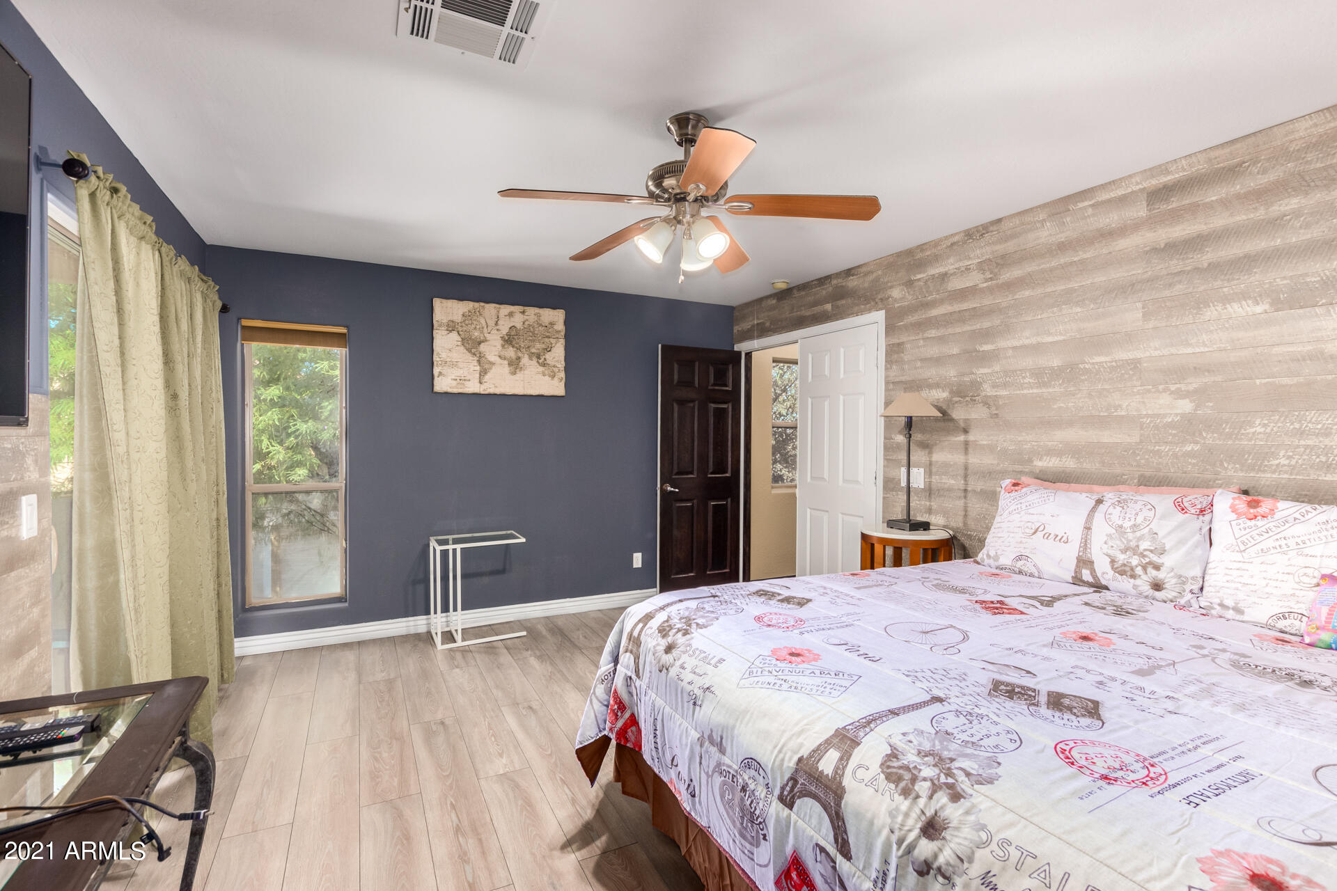 10225 West Camelback Road, Unit 8 Phoenix, AZ 85037 - Photo 23 of 30 a bedroom with a large bed and a window