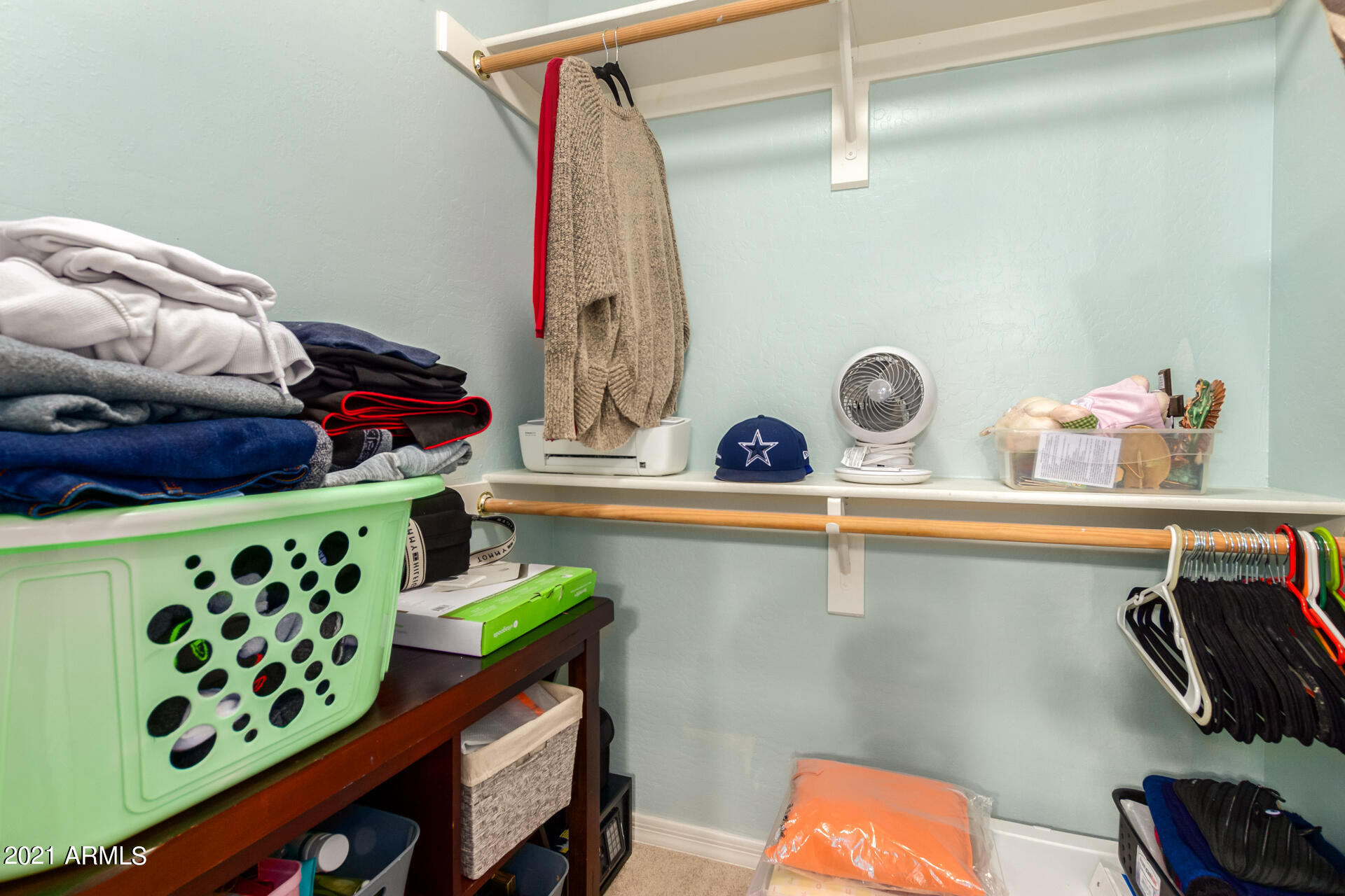 10225 West Camelback Road, Unit 8 Phoenix, AZ 85037 - Photo 25 of 30 a view of walk in closet with clothes and shoes