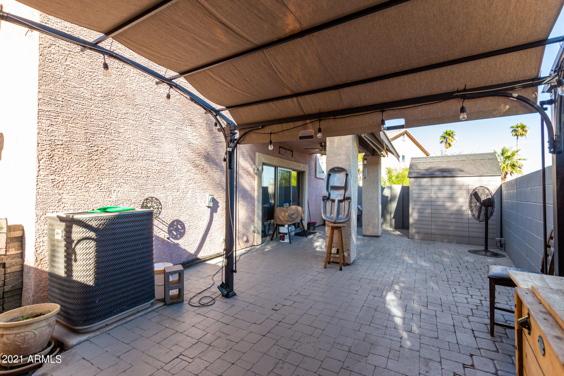 10225 West Camelback Road, Unit 8 Phoenix, AZ 85037 - Photo 29 of 30 a view of a porch with a table and chairs