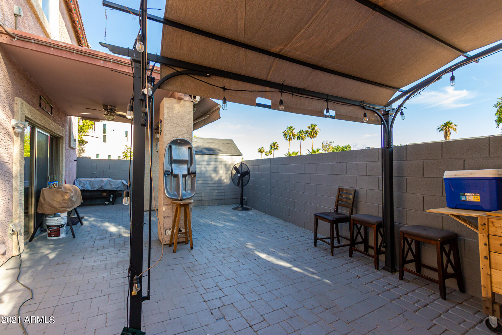 10225 West Camelback Road, Unit 8 Phoenix, AZ 85037 - Photo 30 of 30 a view of a porch with furniture and a potted plant