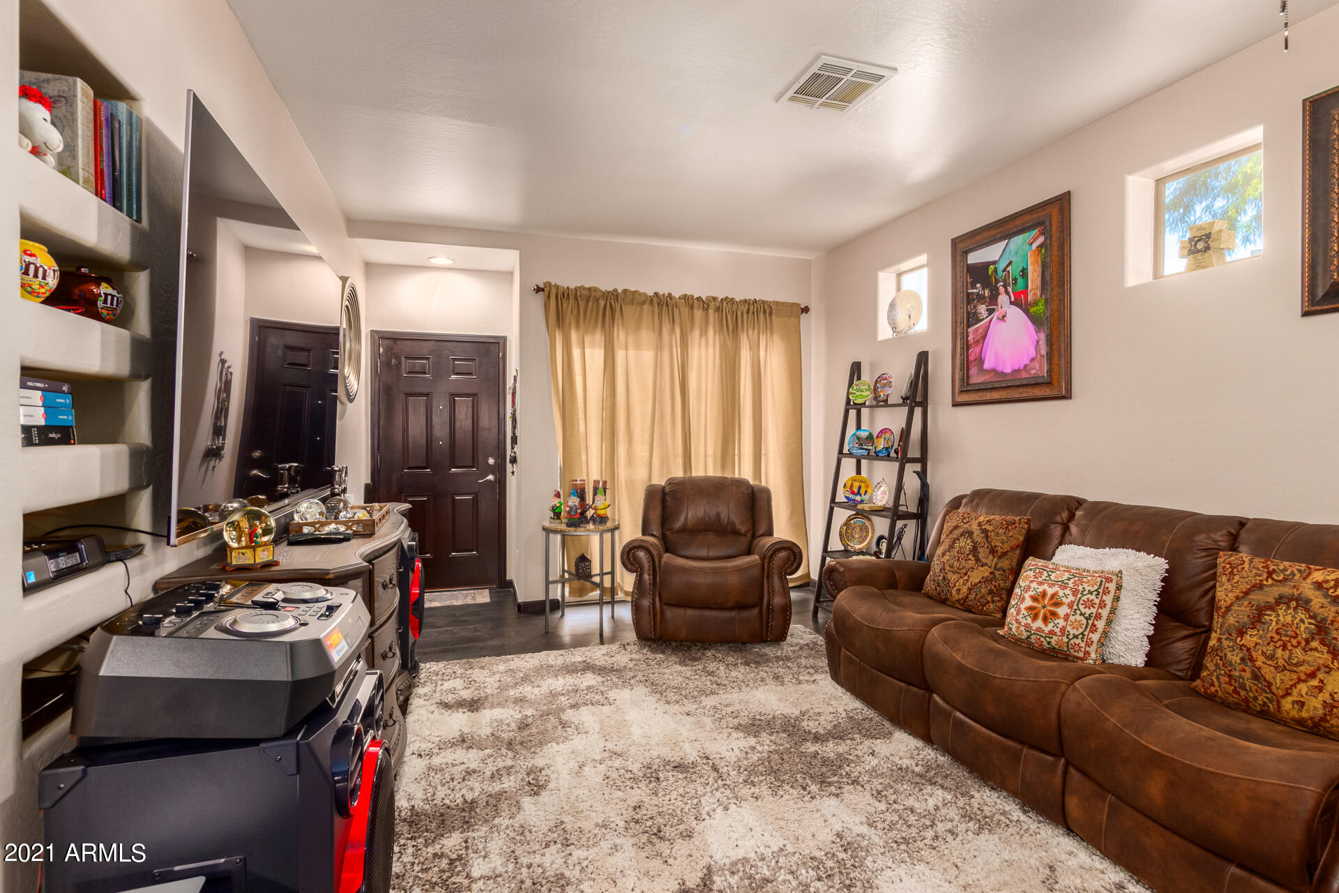 10225 West Camelback Road, Unit 8 Phoenix, AZ 85037 - Photo 5 of 30 a living room with furniture and large window