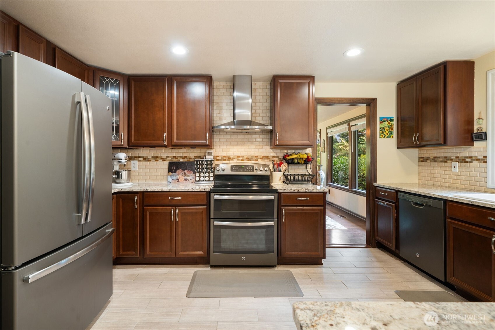 383 Kirner Road Sequim, WA 98382 - Photo 11 of 40 a kitchen with stainless steel appliances granite countertop a refrigerator stove and oven