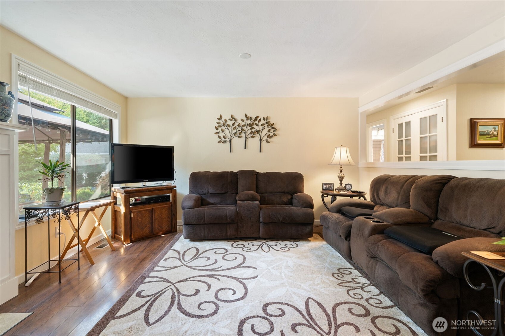 383 Kirner Road Sequim, WA 98382 - Photo 14 of 40 a living room with furniture a flat screen tv and a large window