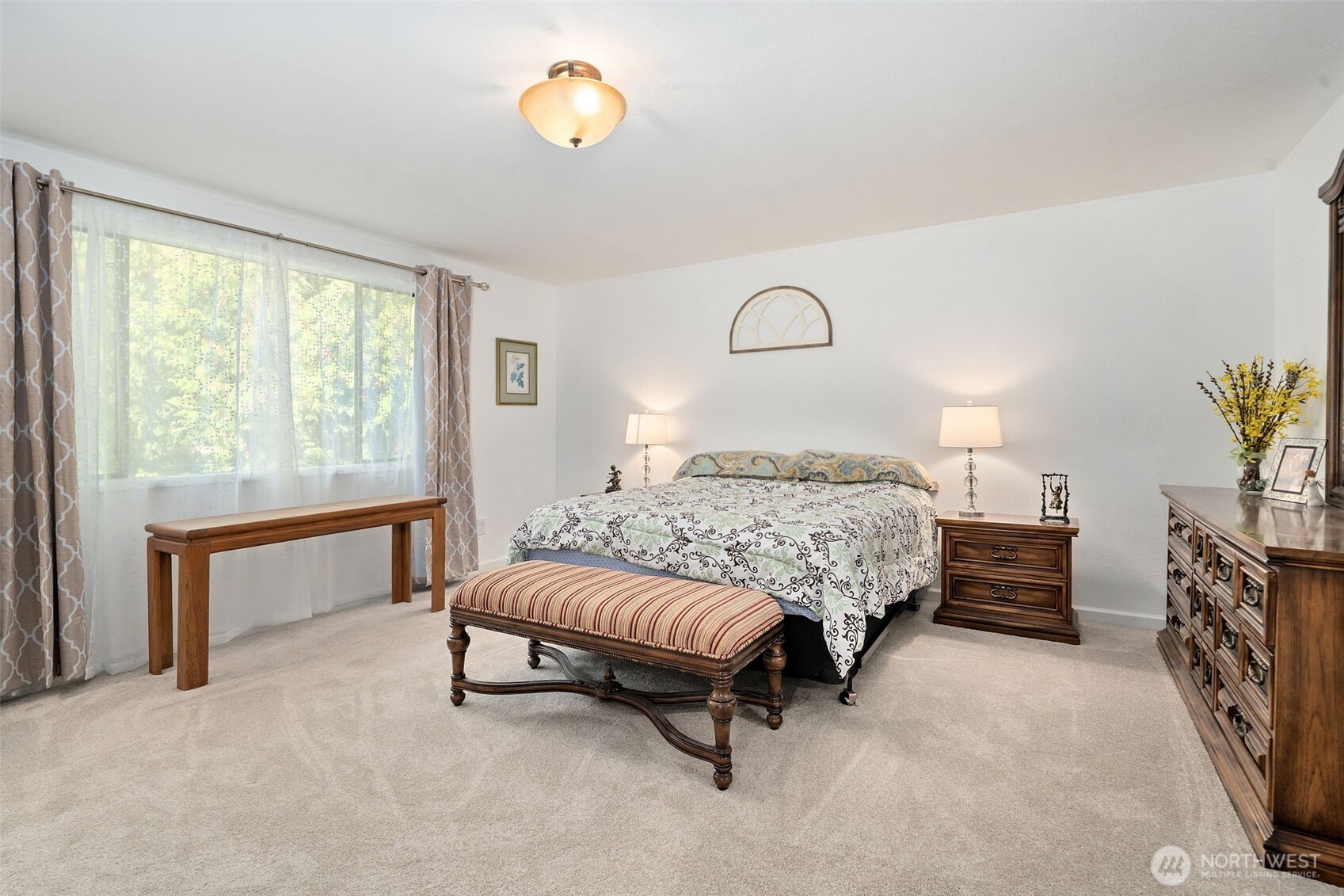 383 Kirner Road Sequim, WA 98382 - Photo 17 of 40 a bedroom with a bed and a window