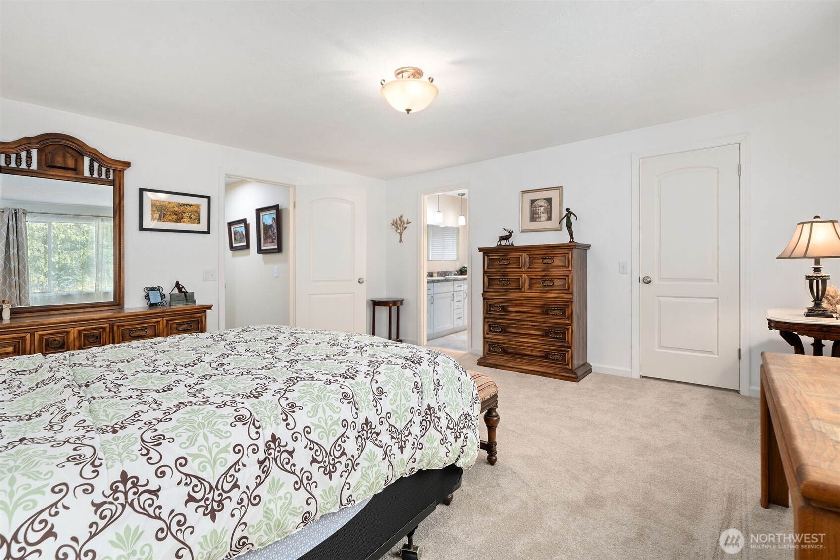 383 Kirner Road Sequim, WA 98382 - Photo 18 of 40 a bedroom with a bed and a cabinets