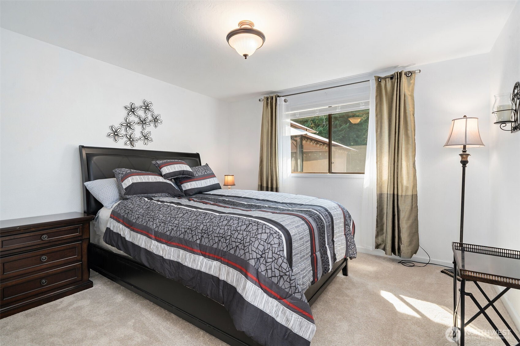 383 Kirner Road Sequim, WA 98382 - Photo 20 of 40 a bedroom with a bed wooden floor and window
