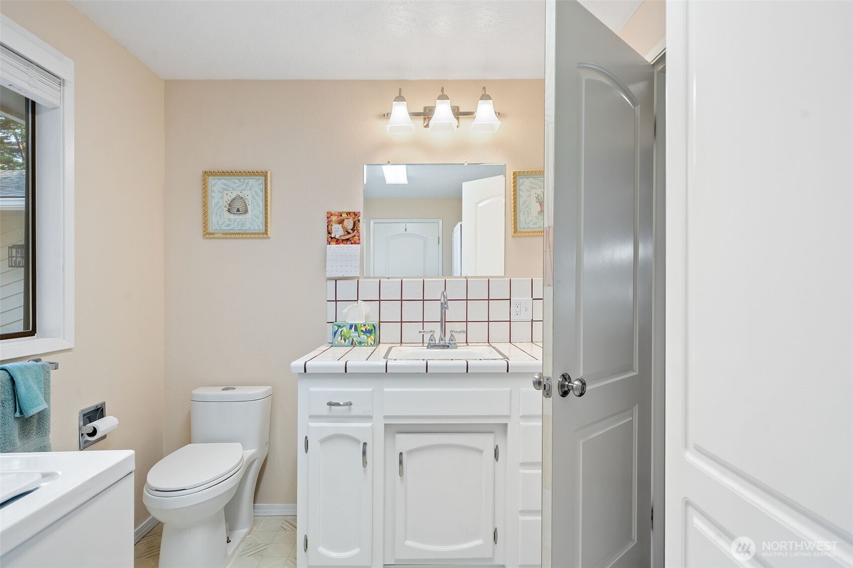 383 Kirner Road Sequim, WA 98382 - Photo 23 of 40 a bathroom with a sink vanity mirror and toilet