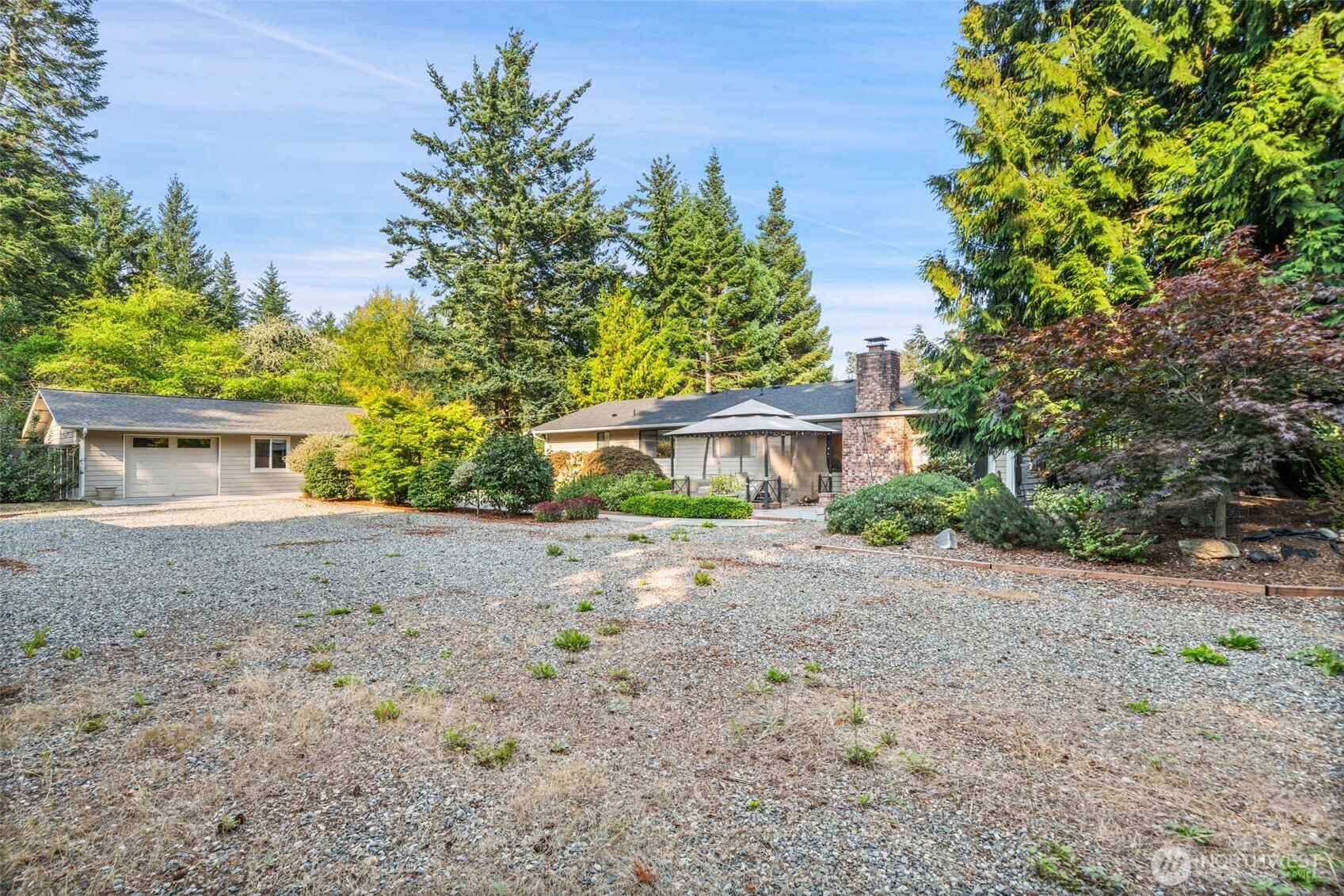 383 Kirner Road Sequim, WA 98382 - Photo 29 of 40 a front view of a house with a yard and a garage
