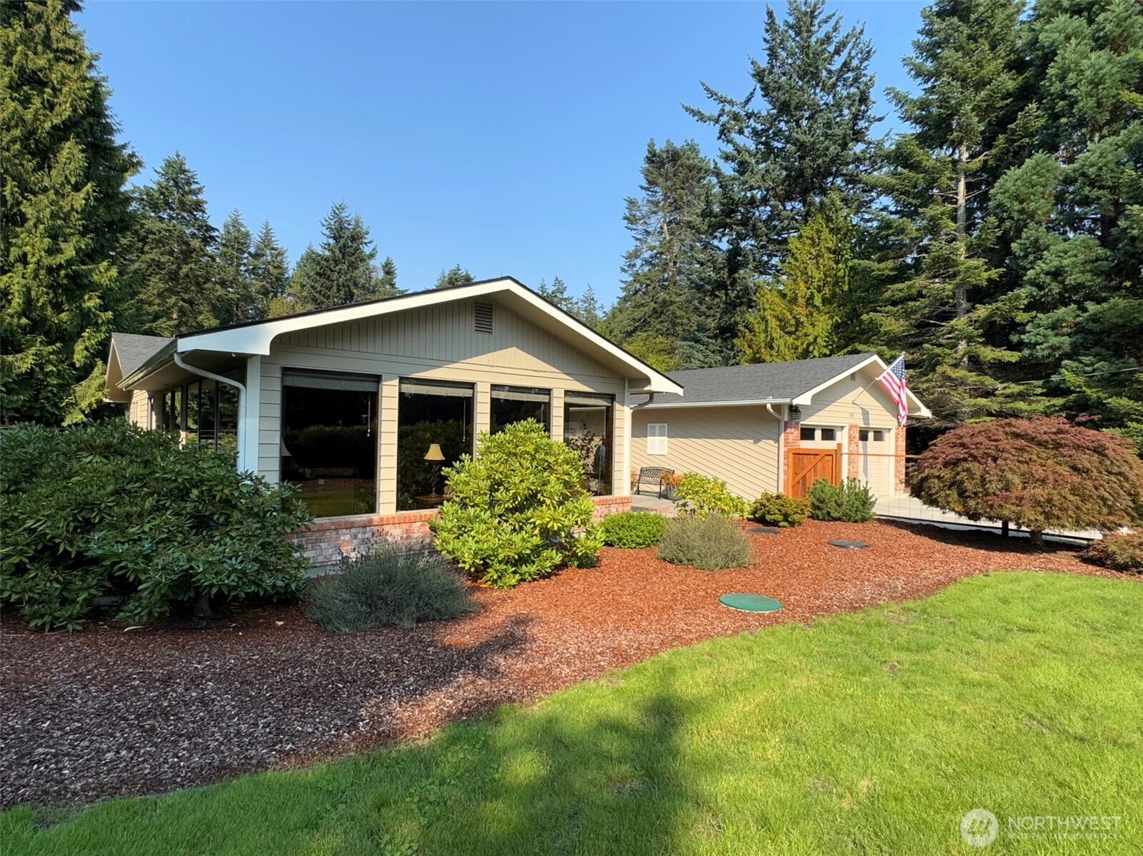 383 Kirner Road Sequim, WA 98382 - Photo 3 of 40 a front view of house with yard and green space