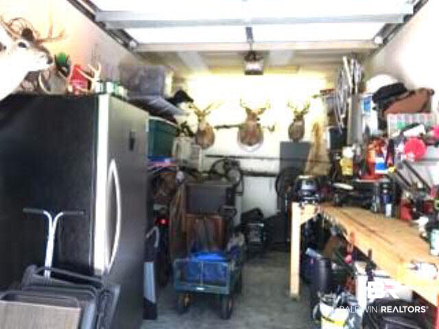 25773 Canal Road, Unit 26 Orange Beach, AL 36561 - Photo 24 of 42 Current owner is using the garage as a workshop and storage area.