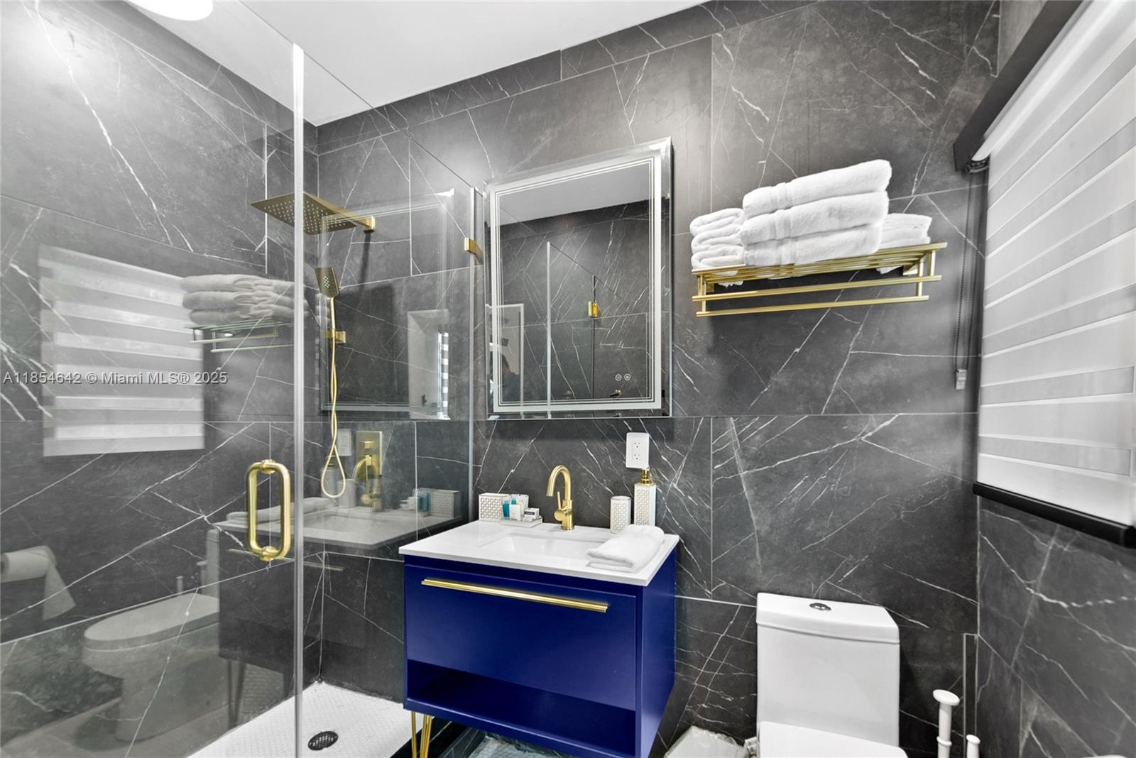 91865 Overseas Highway, Unit 104 Tavernier, FL 33070 - Photo 6 of 6 a bathroom with a sink and mirror