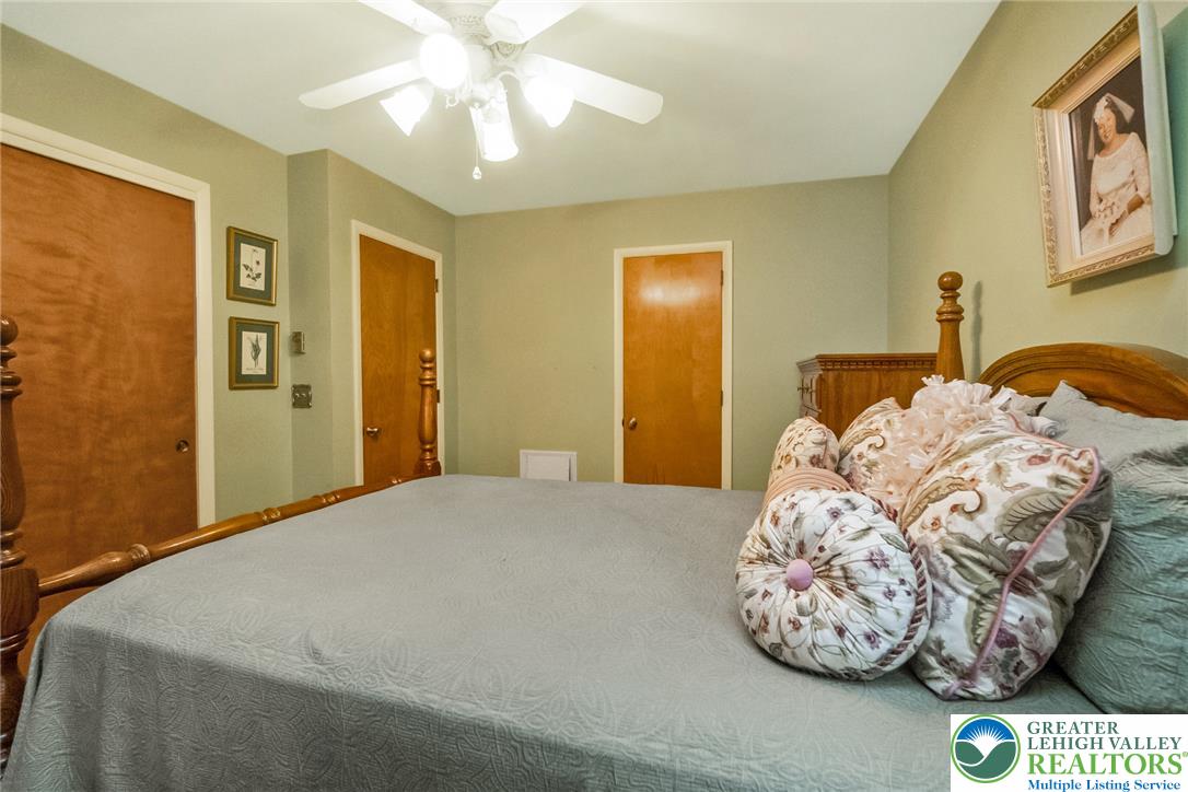 1328 Russett Road Allentown, PA 18104 - Photo 30 of 46 The cozy bedroom features a ceiling fan, offering a comfortable retreat.